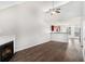 Open-concept living room with a fireplace and a view to the kitchen at 222 Ben Ln, Fairburn, GA 30213