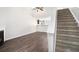 Spacious living room with hardwood floors, fireplace, and open staircase at 222 Ben Ln, Fairburn, GA 30213