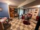 Spacious basement area with checkered floors, bar area, and some furniture and decor at 2323 Valleyside Dr, Decatur, GA 30032