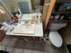 Bathroom with a tile floor, vanity, sink, mirror and toilet at 2323 Valleyside Dr, Decatur, GA 30032