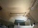 A tub with safety bars and tile walls at 2323 Valleyside Dr, Decatur, GA 30032