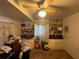 Bedroom featuring built-in bookshelves, ceiling fan, and window with natural light at 2323 Valleyside Dr, Decatur, GA 30032