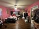 Bedroom with hardwood floors, ceiling fan, and pink walls at 2323 Valleyside Dr, Decatur, GA 30032