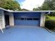 View of the blue, single car garage at 2323 Valleyside Dr, Decatur, GA 30032