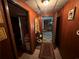 Hallway leading to other rooms, with a runner rug and miscellaneous decorations at 2323 Valleyside Dr, Decatur, GA 30032
