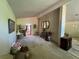 Open concept living room with brick wall, decorative mirrors, and chandelier at 2323 Valleyside Dr, Decatur, GA 30032