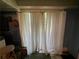 Room with white lace curtains hanging in front of a window, dark paint and miscellaneous decor at 2323 Valleyside Dr, Decatur, GA 30032