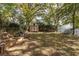 Large backyard with a shed, garden, mature trees, and privacy fence at 360 Kelly Se St, Atlanta, GA 30312
