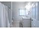Clean bathroom featuring a white vanity, modern fixtures, and a shower with white curtain at 360 Kelly Se St, Atlanta, GA 30312