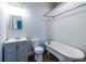 Bathroom with claw foot tub, gray vanity, and modern fixtures at 360 Kelly Se St, Atlanta, GA 30312