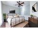 Bedroom with black metal bed frame, ceiling fan, and neutral decor at 360 Kelly Se St, Atlanta, GA 30312