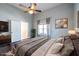 Bedroom featuring a ceiling fan, lots of pillows and large windows with curtains at 360 Kelly Se St, Atlanta, GA 30312