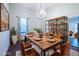 Dining room featuring a wooden table with seating for six and a decorative chandelier at 360 Kelly Se St, Atlanta, GA 30312