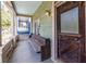 Inviting front porch with bench seating and unique front door at 360 Kelly Se St, Atlanta, GA 30312