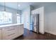 Kitchen view with stainless refrigerator and an island with white marble countertop at 360 Kelly Se St, Atlanta, GA 30312