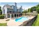 Stunning backyard showcases a private pool, deck, and well-maintained landscaping at 5513 Lavender Farms Rd, Powder Springs, GA 30127