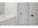 Bathroom vanity with white cabinets, tile floors, and chrome faucet at 5513 Lavender Farms Rd, Powder Springs, GA 30127