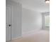 Bedroom showcases neutral colors, carpet, and natural light at 5513 Lavender Farms Rd, Powder Springs, GA 30127