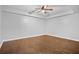The bedroom features hardwood floors, recessed lighting, and a ceiling fan, providing a cozy and comfortable retreat at 5513 Lavender Farms Rd, Powder Springs, GA 30127