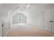 Bright bonus room features vaulted ceilings, ceiling fans, and a window for natural light at 5513 Lavender Farms Rd, Powder Springs, GA 30127