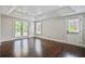 Bright bonus room offers hardwood floors, access to the outdoors, and an inviting atmosphere for relaxation at 5513 Lavender Farms Rd, Powder Springs, GA 30127