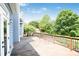 Large wooden deck overlooking a tree-filled backyard with wood railing at 5513 Lavender Farms Rd, Powder Springs, GA 30127