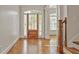 Bright foyer boasts hardwood floors and detailed trim at 5513 Lavender Farms Rd, Powder Springs, GA 30127