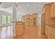 Spacious kitchen with stainless steel appliances, light wood cabinets and a breakfast bar at 5513 Lavender Farms Rd, Powder Springs, GA 30127