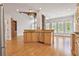 Open concept kitchen with island and stainless steel appliances overlooking the living area at 5513 Lavender Farms Rd, Powder Springs, GA 30127