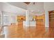 Spacious living area features hardwood floors, a kitchen view, and an adjacent dining area, great for entertaining at 5513 Lavender Farms Rd, Powder Springs, GA 30127