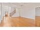 Spacious living room featuring coffered ceilings, hardwood floors, and a grand staircase at 5513 Lavender Farms Rd, Powder Springs, GA 30127
