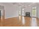 Bright living room with fireplace, hardwood floors, and large windows at 5513 Lavender Farms Rd, Powder Springs, GA 30127