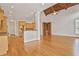Open-concept living space with hardwood floors, natural lighting and a cathedral ceiling at 5513 Lavender Farms Rd, Powder Springs, GA 30127