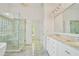 Luxurious main bathroom features marble floors, dual sinks, and a glass-enclosed shower at 5513 Lavender Farms Rd, Powder Springs, GA 30127