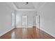 Spacious main bedroom offering tray ceiling, hardwood floors, and ample natural light at 5513 Lavender Farms Rd, Powder Springs, GA 30127