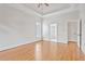 Bright main bedroom offering hardwood floors and a private bath at 5513 Lavender Farms Rd, Powder Springs, GA 30127