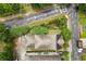 A bird's eye view showcases a beautiful home's roof and surrounding lush greenery at 1184 Medlin Se St, Smyrna, GA 30080