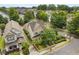 An aerial view shows a well-maintained home with mature trees in a desirable neighborhood at 1184 Medlin Se St, Smyrna, GA 30080