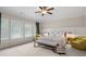 Spacious bedroom featuring a ceiling fan, and natural light from the windows, creating a tranquil retreat at 1184 Medlin Se St, Smyrna, GA 30080
