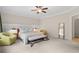Spacious bedroom featuring a ceiling fan, and natural light from the windows, creating a tranquil retreat at 1184 Medlin Se St, Smyrna, GA 30080