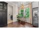 Bright breakfast nook featuring a modern light fixture, stainless appliances and a plant-filled view of the outdoors at 1184 Medlin Se St, Smyrna, GA 30080