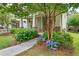 Charming home exterior with a sidewalk path and lush landscaping at 1184 Medlin Se St, Smyrna, GA 30080