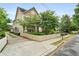 Beautiful house with a manicured lawn, complemented by lush trees and a charming white picket fence at 1184 Medlin Se St, Smyrna, GA 30080