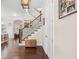 Elegant foyer with hardwood floors, staircase with iron spindles, and tasteful decor that adds charm at 1184 Medlin Se St, Smyrna, GA 30080