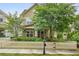 Charming two-story home with a welcoming front yard, lush landscaping, and a classic white picket fence at 1184 Medlin Se St, Smyrna, GA 30080