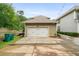 Two car garage with a large driveway and yard space at 1184 Medlin Se St, Smyrna, GA 30080