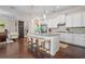 Spacious kitchen with granite countertops, an island with seating, stainless steel appliances, and an open floor plan at 1184 Medlin Se St, Smyrna, GA 30080
