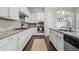 Gourmet kitchen with stainless steel appliances, granite countertops, tile backsplash, and ample counter space at 1184 Medlin Se St, Smyrna, GA 30080
