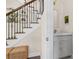 Stylish powder room adjacent to the staircase, featuring a marble countertop and elegant fixtures at 1184 Medlin Se St, Smyrna, GA 30080