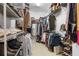 Organized walk-in closet with ample shelving and hanging space for clothes, shoes, and accessories at 1184 Medlin Se St, Smyrna, GA 30080